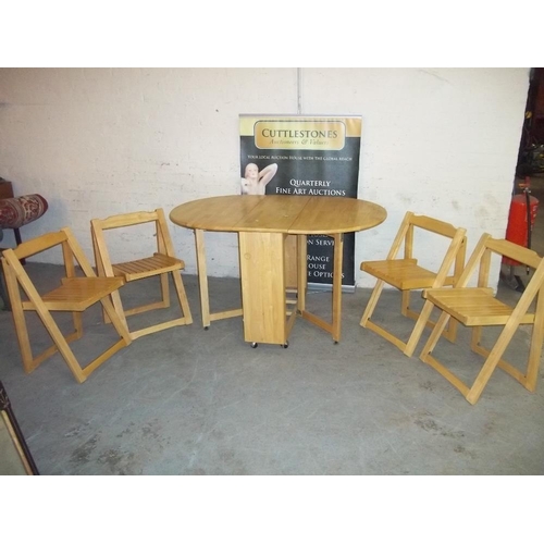 762 - A STORAWAY KITCHEN TABLE AND FOUR CHAIRS