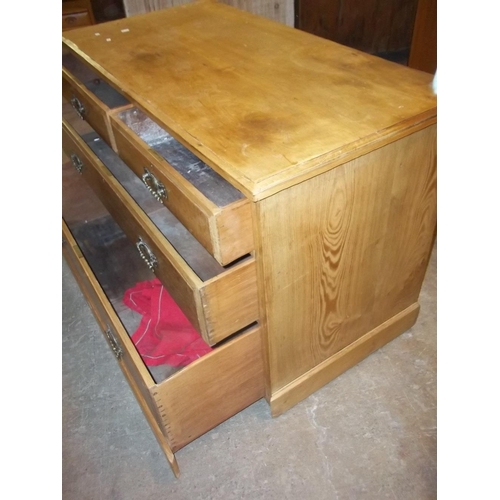 765 - AN OAK CHEST OF DRAWERS (TWO OVER TWO) WITH BRASS DROP SWAN NECK HANDLES