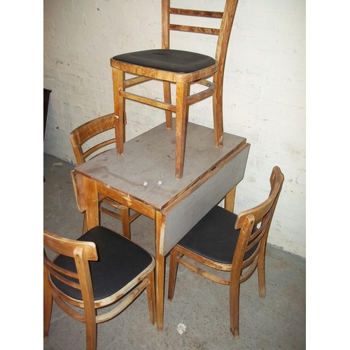 767 - A VINTAGE DROP LEAF FORMICA KITCHEN TABLE AND FOUR CHAIRS