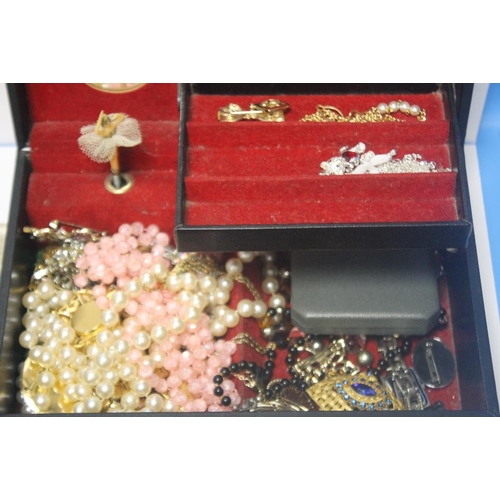 11 - A QUANTITY OF COSTUME JEWELLERY