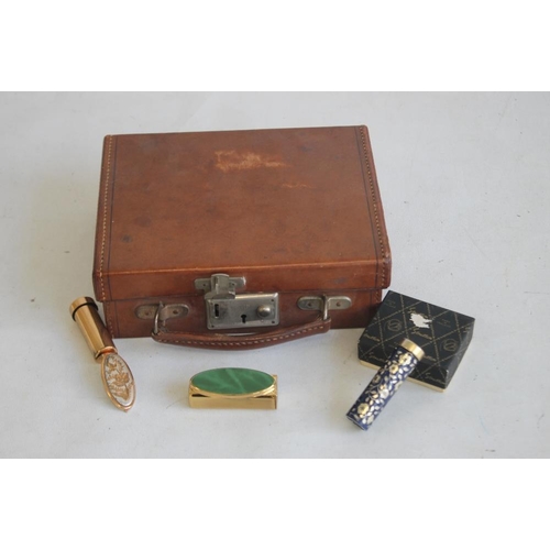 29 - A MINIATURE CHILD'S LEATHER SUITCASE, together with a boxed stratton lipstick mirror and two other v... 