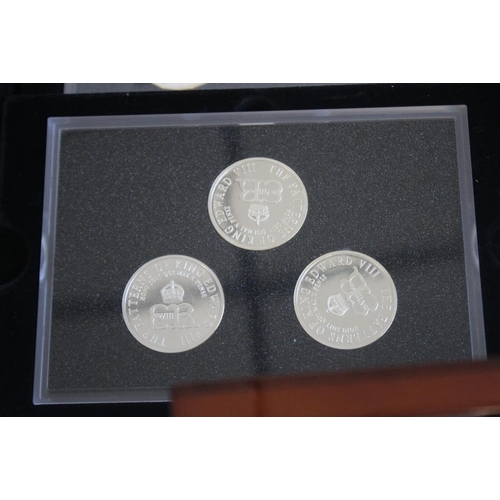 59 - A COLLECTION OF BOXED COMMEMORATIVE COINS, to include three Edward VIII retro sets, a set of St Hele... 