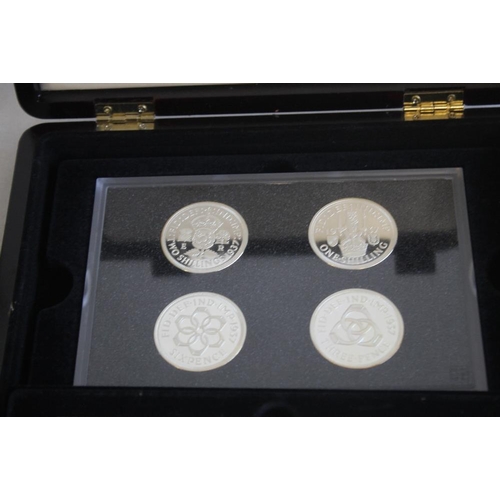 59 - A COLLECTION OF BOXED COMMEMORATIVE COINS, to include three Edward VIII retro sets, a set of St Hele... 