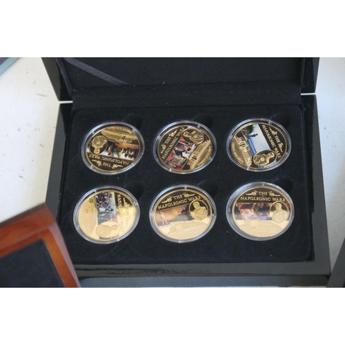 59 - A COLLECTION OF BOXED COMMEMORATIVE COINS, to include three Edward VIII retro sets, a set of St Hele... 