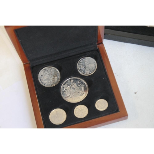 59 - A COLLECTION OF BOXED COMMEMORATIVE COINS, to include three Edward VIII retro sets, a set of St Hele... 