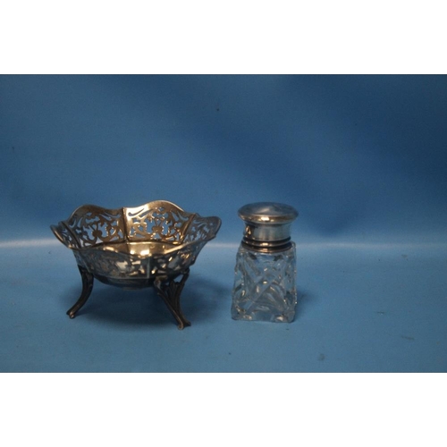 6 - A HALLMARKED SILVER PIERCED BASKET, together with a silver topped bottle (2)