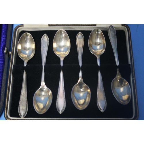 7 - A CASED SET OF HALLMARKED SILVER TEASPOONS together with another cased spoon