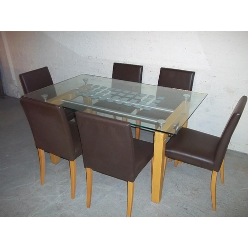 717 - A GLASS DINING SET WITH SIX FAUX LEATHER CHAIRS