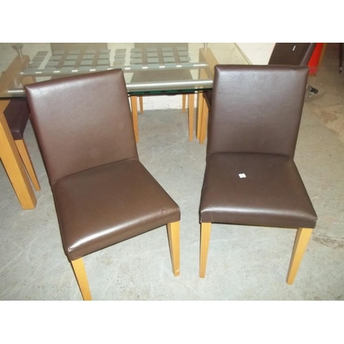 717 - A GLASS DINING SET WITH SIX FAUX LEATHER CHAIRS