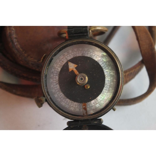 78 - A WWI MARCHING COMPASS, DATED 1918 in fitted leather case