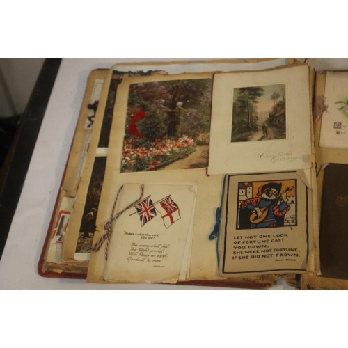 181 - AN EDWARDIAN SCRAP BOOK CONTAINING A COLLECTION OF GREETINGS CARDS, to include various dated example... 