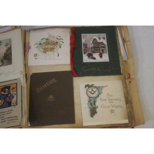 181 - AN EDWARDIAN SCRAP BOOK CONTAINING A COLLECTION OF GREETINGS CARDS, to include various dated example... 