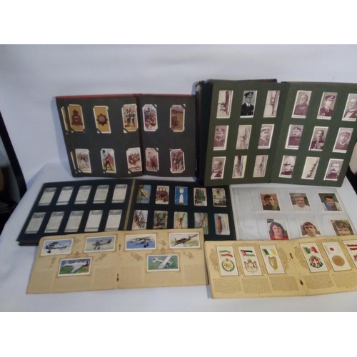 203 - A COLLECTION OF CIGARETTE AND TEA CARDS IN ALBUMS, to include Naval portraits, Dickens types, Natura... 