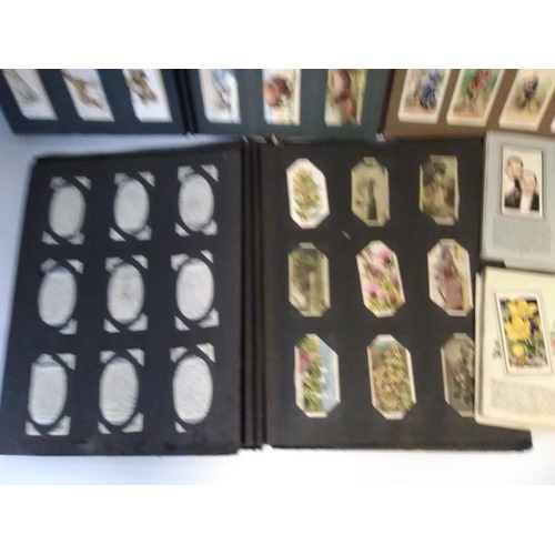 204 - A QUANTITY OF ALBUMS OF CIGARETTE CARDS, to include Wild Flowers, Fresh Water Fish, Natural Flags, R... 