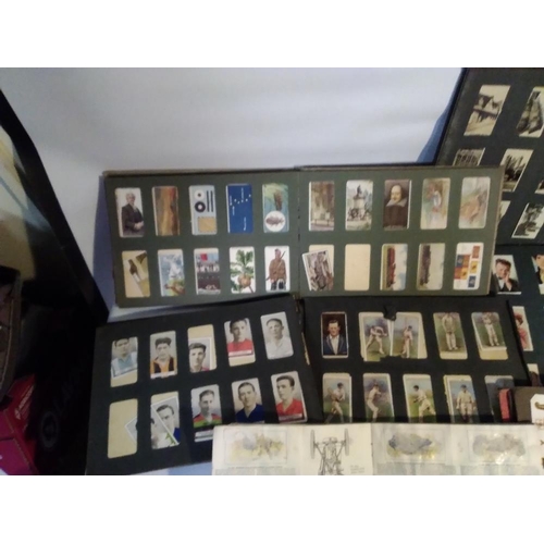 209 - TWO BOXES OF CIGARETTE CARDS, MAINLY IN ALBUMS, to include a small quantity of silks