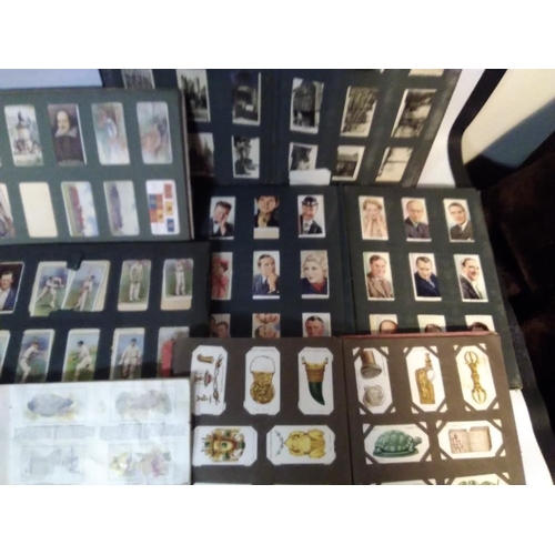 209 - TWO BOXES OF CIGARETTE CARDS, MAINLY IN ALBUMS, to include a small quantity of silks