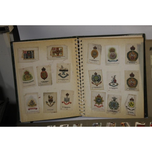 214 - A COLLECTION OF CIGARETTE CARDS IN VARIOUS ALBUMS, to include a small quantity of silks of British m... 