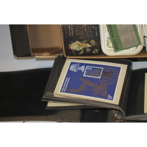 217 - A COLLECTION OF TEA AND CIGARETTE CARDS and a quantity of Royal Mail stamp postcards, presentation p... 