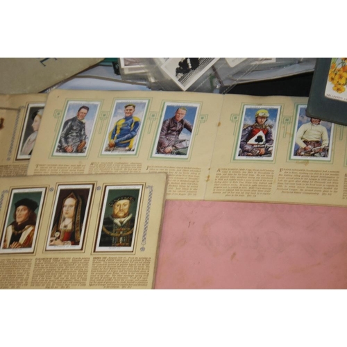 219 - A QUANTITY OF CIGARETTE CARDS LOOSE AND IN ALBUMS, to include The Kings and Queens of England, How W... 