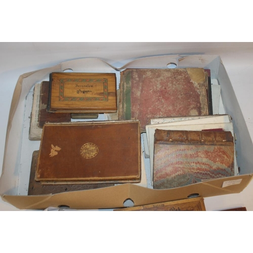 140 - A TRAY OF ANTIQUARIAN BOOKS to include three wood covered middle eastern books, one including photog... 