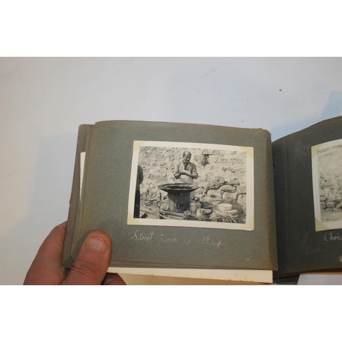 140 - A TRAY OF ANTIQUARIAN BOOKS to include three wood covered middle eastern books, one including photog... 