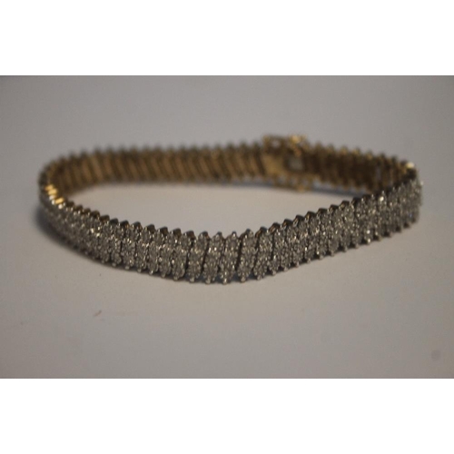 151 - A 9CT GOLD AND SYNTHETIC BRACELET