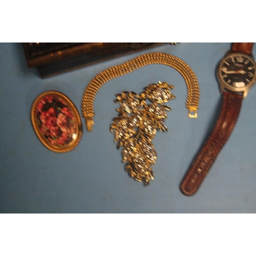 161 - A TIN OF ASSORTED COSTUME JEWELLERY AND A WRIST WATCH