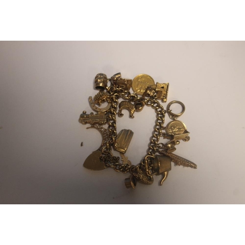 165 - A VINTAGE 9CT GOLD CHARM BRACELET TO INCLUDE A HALF SOVEREIGN CHARM (APPROX WEIGHT 68 GRAM)