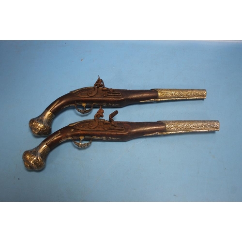 185 - A NEAR PAIR OF EASTERN FLINTLOCK PISTOLS