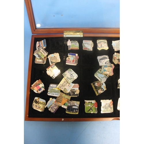 195 - A TRAY CONTAINING A QUANTITY OF DANBURY MINT ENAMELLED PIN BADGES