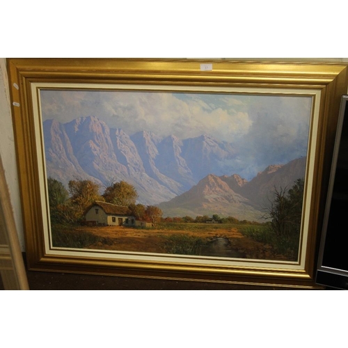 23 - A GILT FRAMED OIL ON CANVAS OF A SOUTH AFRICAN MOUNTAIN SCENE SIGNED BY  CASEY VAN DER LEEK 113 CM X... 