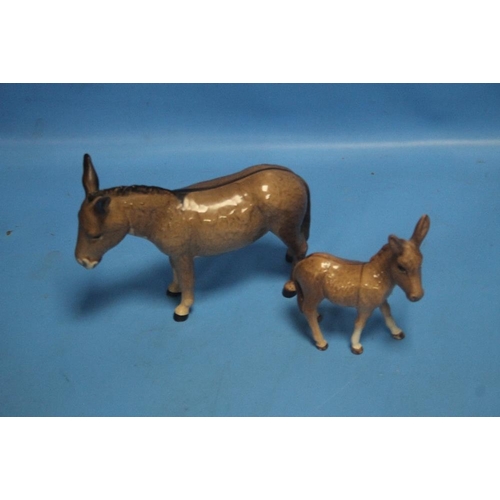 272 - A BESWICK DONKEY AND A FOAL