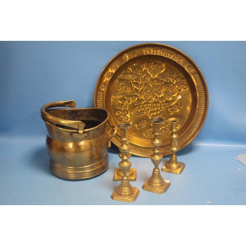 320 - A BRASS COAL BUCKET, A TRAY AND FOUR CANDLESTICKS