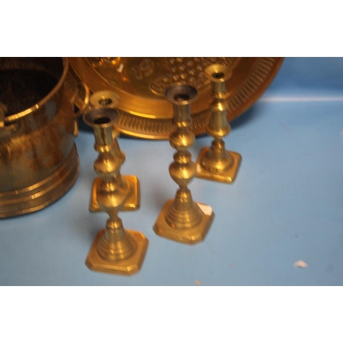 320 - A BRASS COAL BUCKET, A TRAY AND FOUR CANDLESTICKS