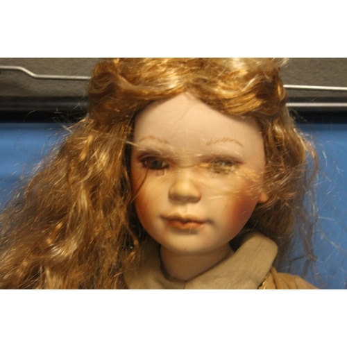 348 - A PORCELAIN HEADED DOLL H 68CM