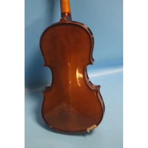 387 - FOUR CASED VIOLINS