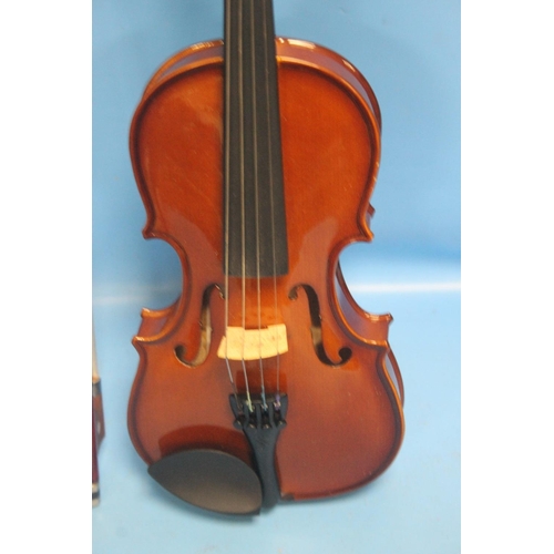 391 - FOUR CASED VIOLINS