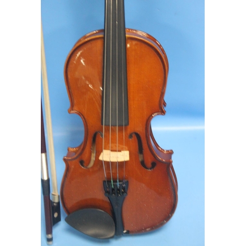 392 - FOUR CASED VIOLINS