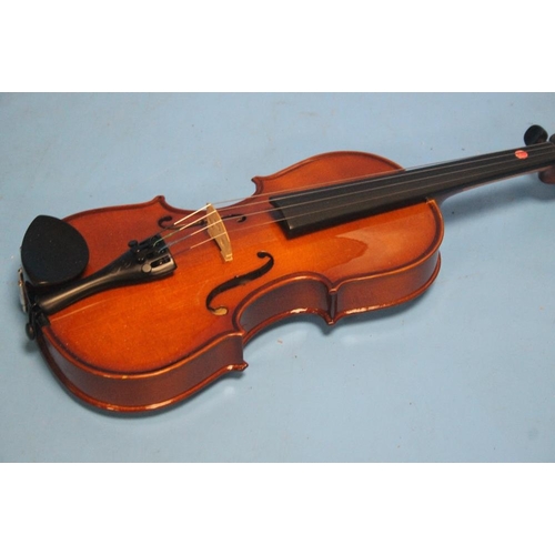 392 - FOUR CASED VIOLINS