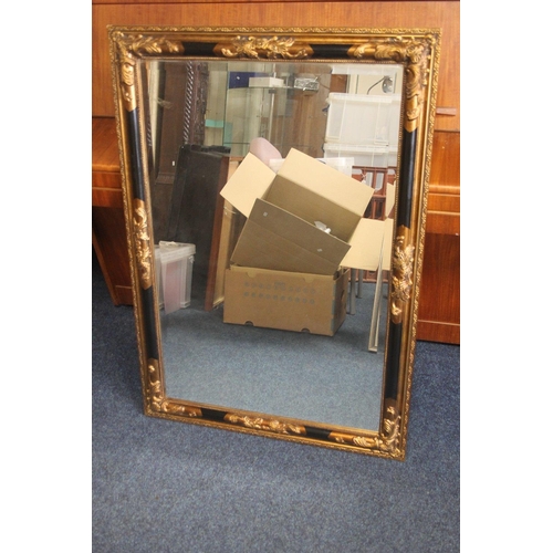 46 - A GILT FRAMED MIRROR 74 X 104 CM