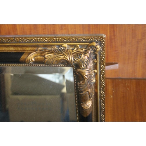 46 - A GILT FRAMED MIRROR 74 X 104 CM