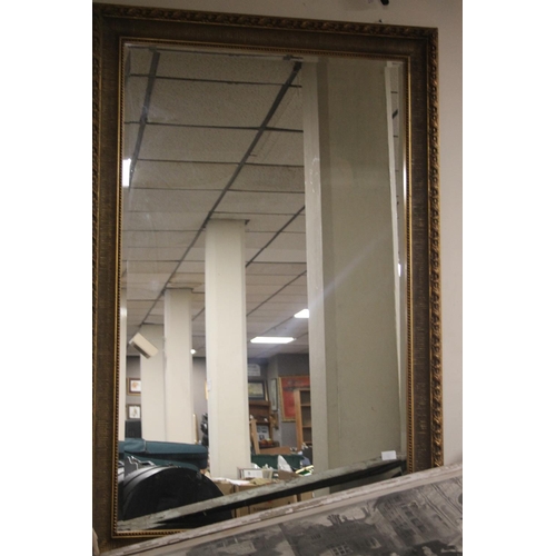 53 - A LARGE GILT FRAMED MIRROR 138 CM X 96 CM