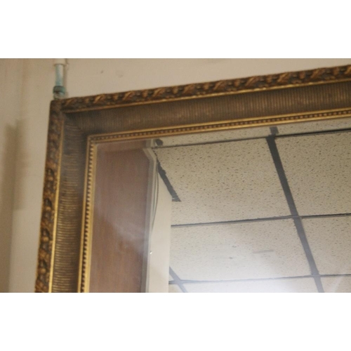 53 - A LARGE GILT FRAMED MIRROR 138 CM X 96 CM