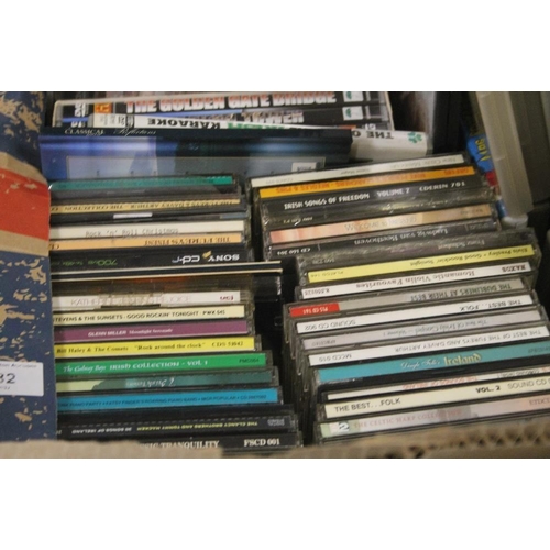 582 - A TRAY OF ASSORTED CD'S AND DVD'S (TRAYS NOT INCLUDED)