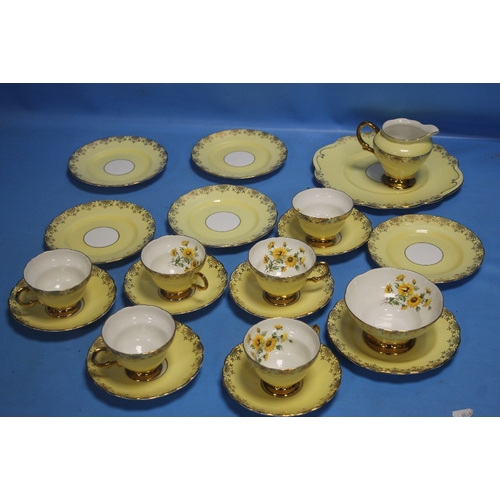 545A - A YELLOW PATTERNED TEA SET