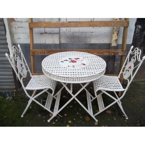 A IRON GARDEN SET INCLUDING A TABLE AND 2 CHAIRS