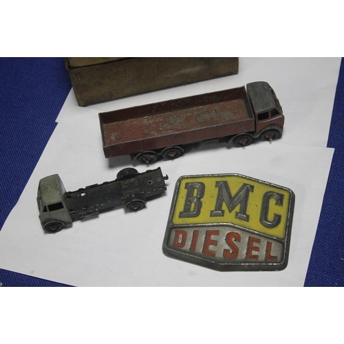 132 - TWO PLAY WORN DINKY VEHICLES , A PAIR OF GOGGLES ETC