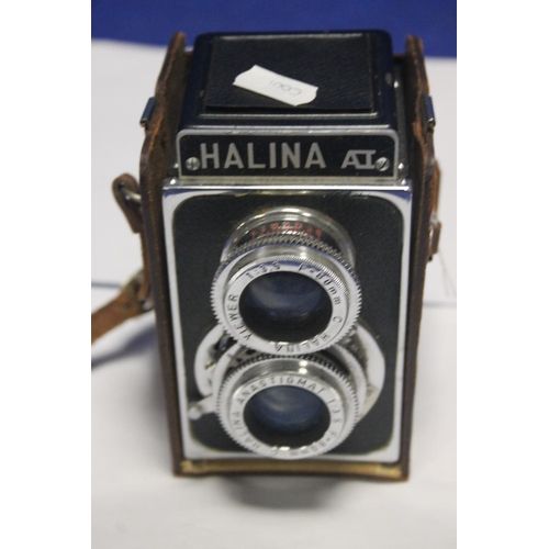 146 - A CASED HALINA CAMERA