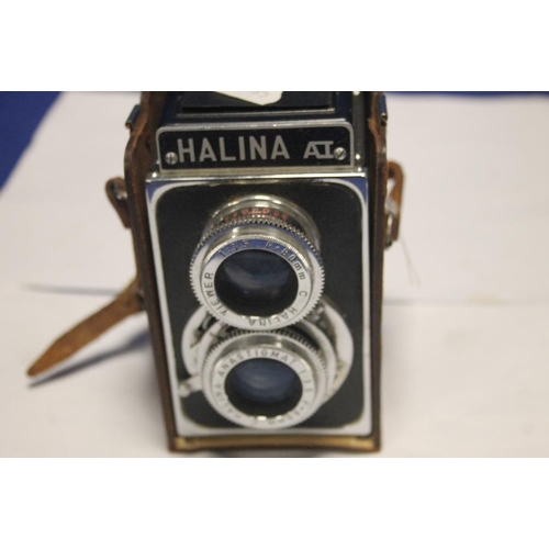 146 - A CASED HALINA CAMERA