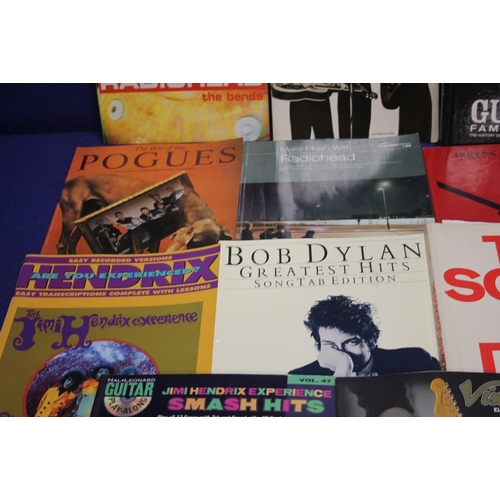 150 - A COLLECTION OF MUSIC RELATED BOOKS TO INCLUDE THE POGUES, BOB DYLAN , BOWIE, RADIO HEAD ETC